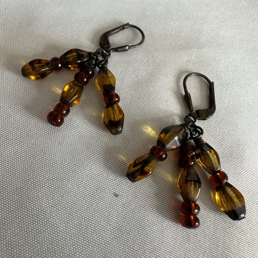 Unusual three strand amber colored bead earrings
